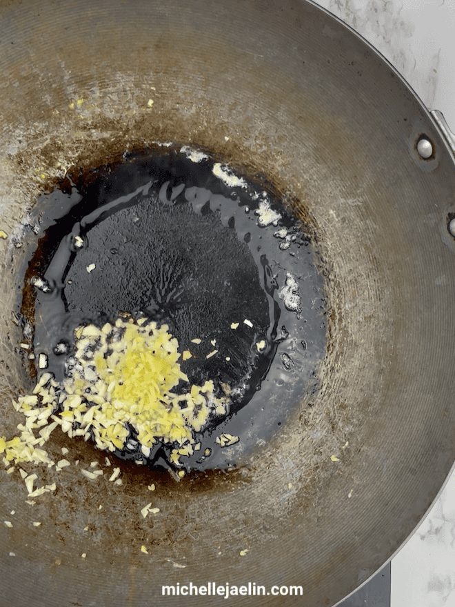 Garlic and ginger heated together in wok