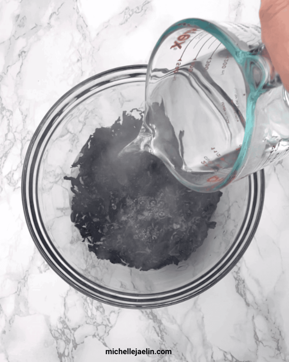 Adding hot water to dried wakame