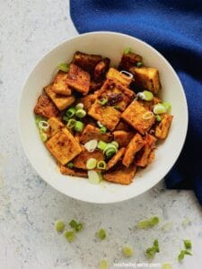 soy garlic tofu topped with chopped green onions