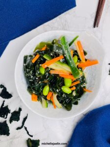 wakame salad in bowl with chopsticks