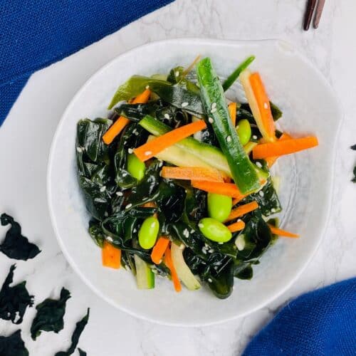 wakame salad in bowl with chopsticks