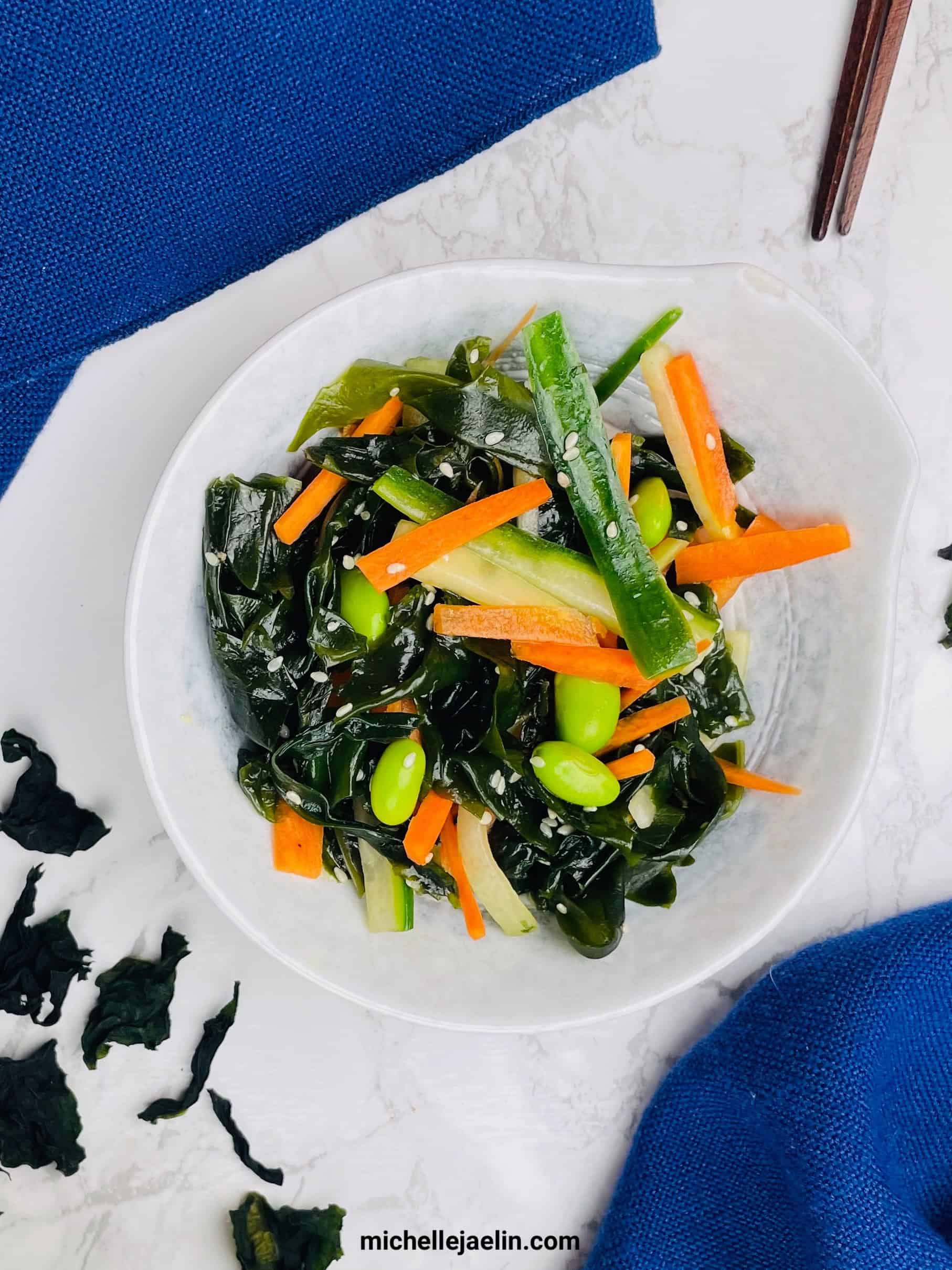 wakame salad in bowl with chopsticks