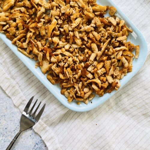 shredded tofu recipe on a plate with a fork