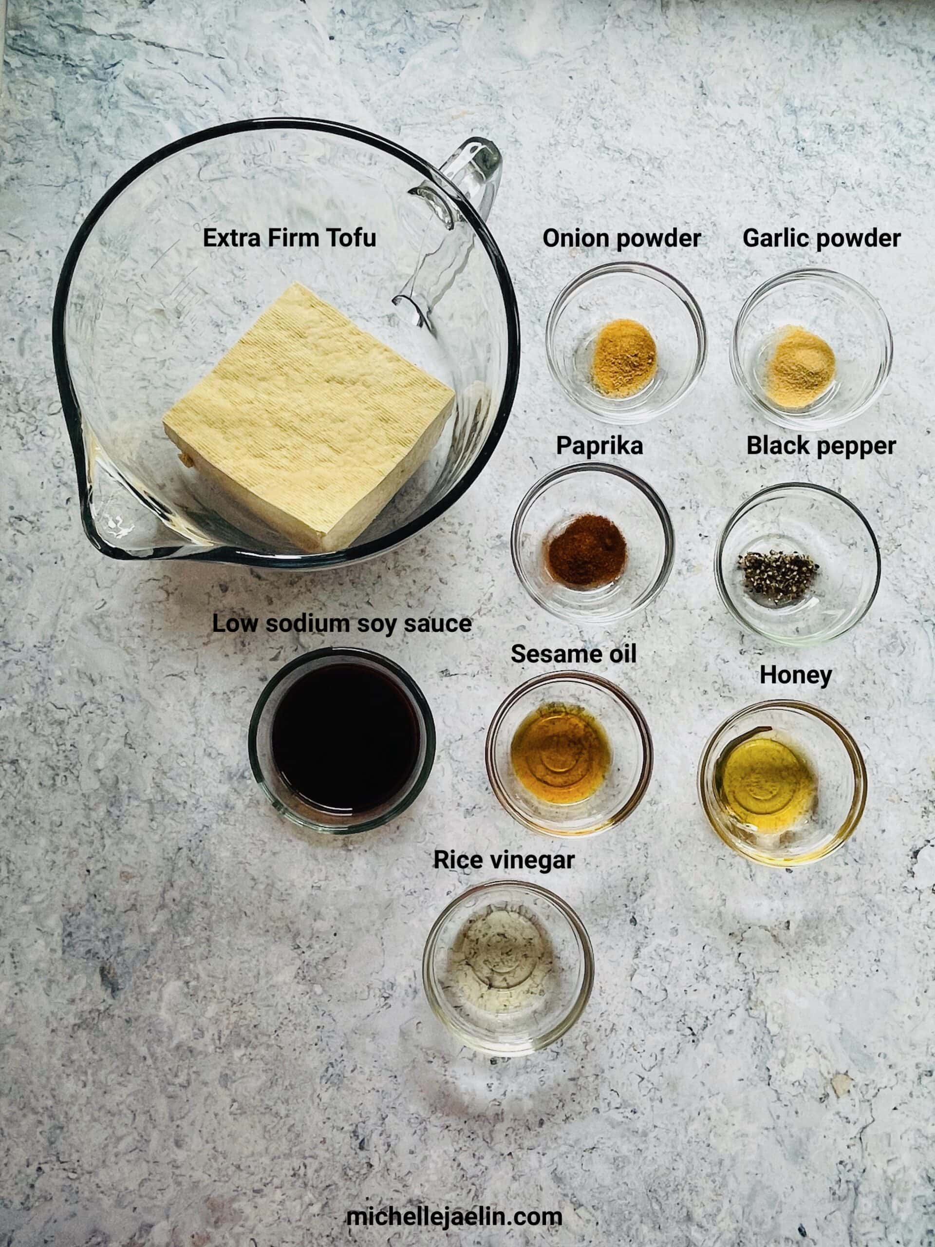 shredded tofu recipe ingredients: firm tofu, paprika, onion powder, garlic powder, black pepper, low sodium soy sauce, sesame oil, honey and rice vinegar.