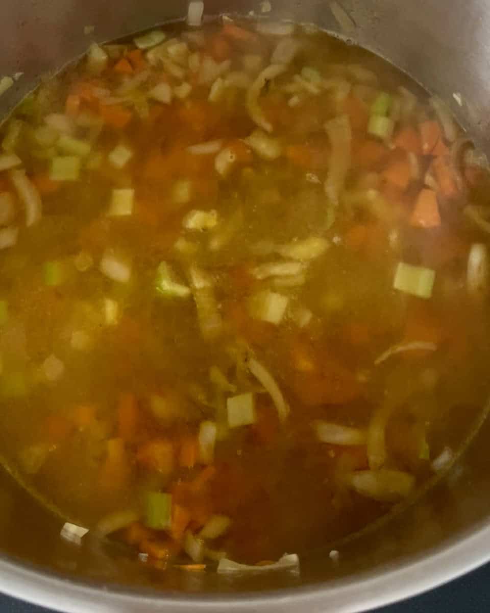 Vegetable stock and water added to pot