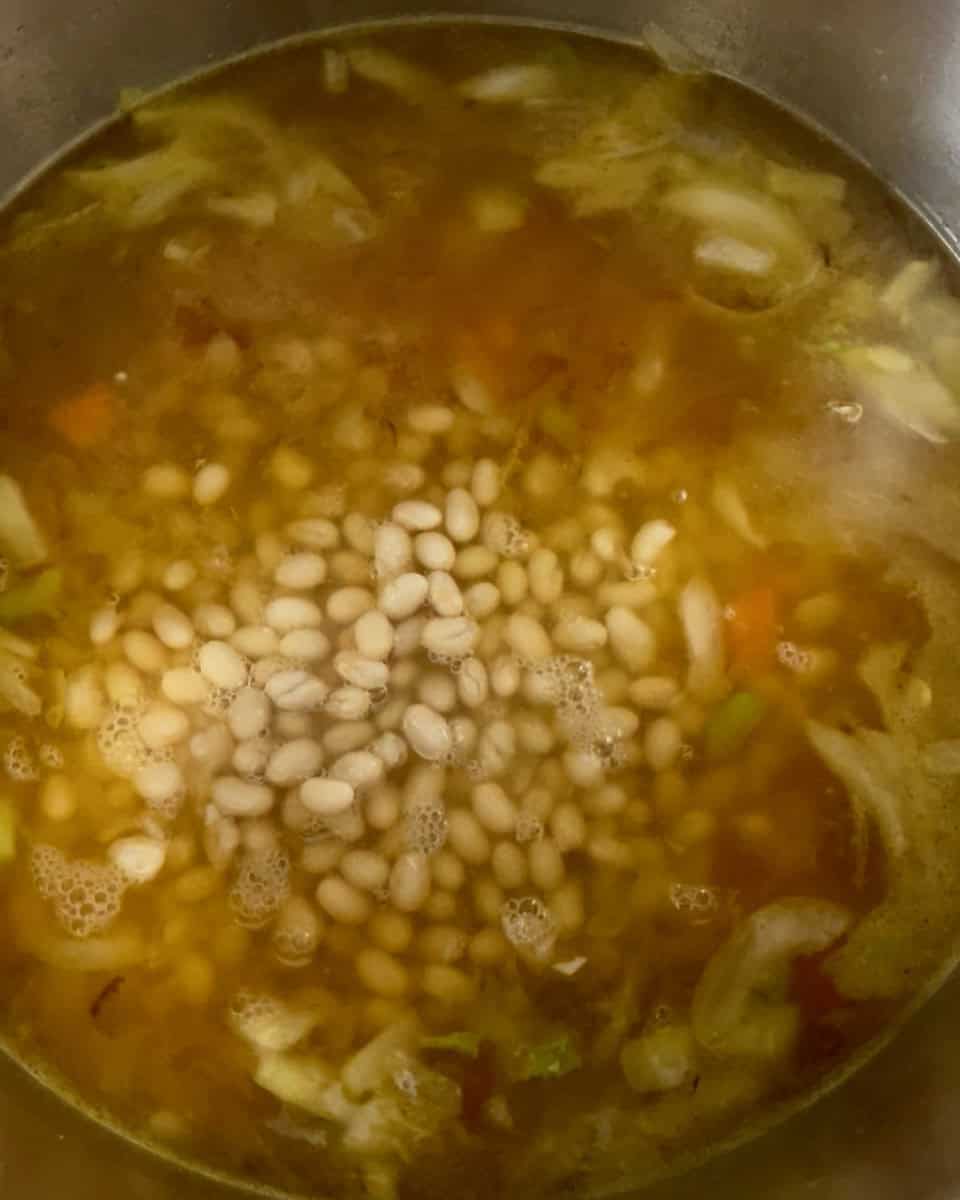 White beans added to the pot