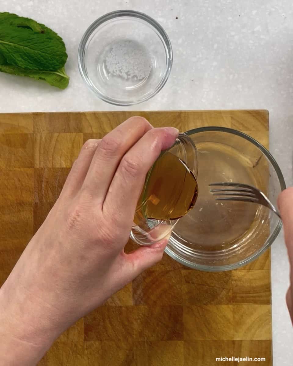 maple syrup or honey being added to small bowl