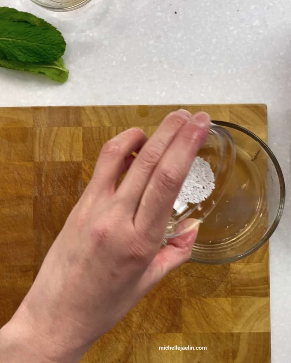 sea salt being added to small bowl